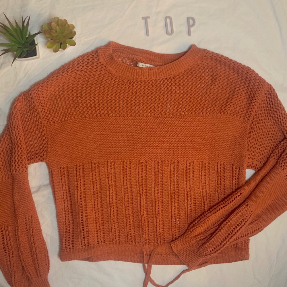 Cropped cinched orange sweater